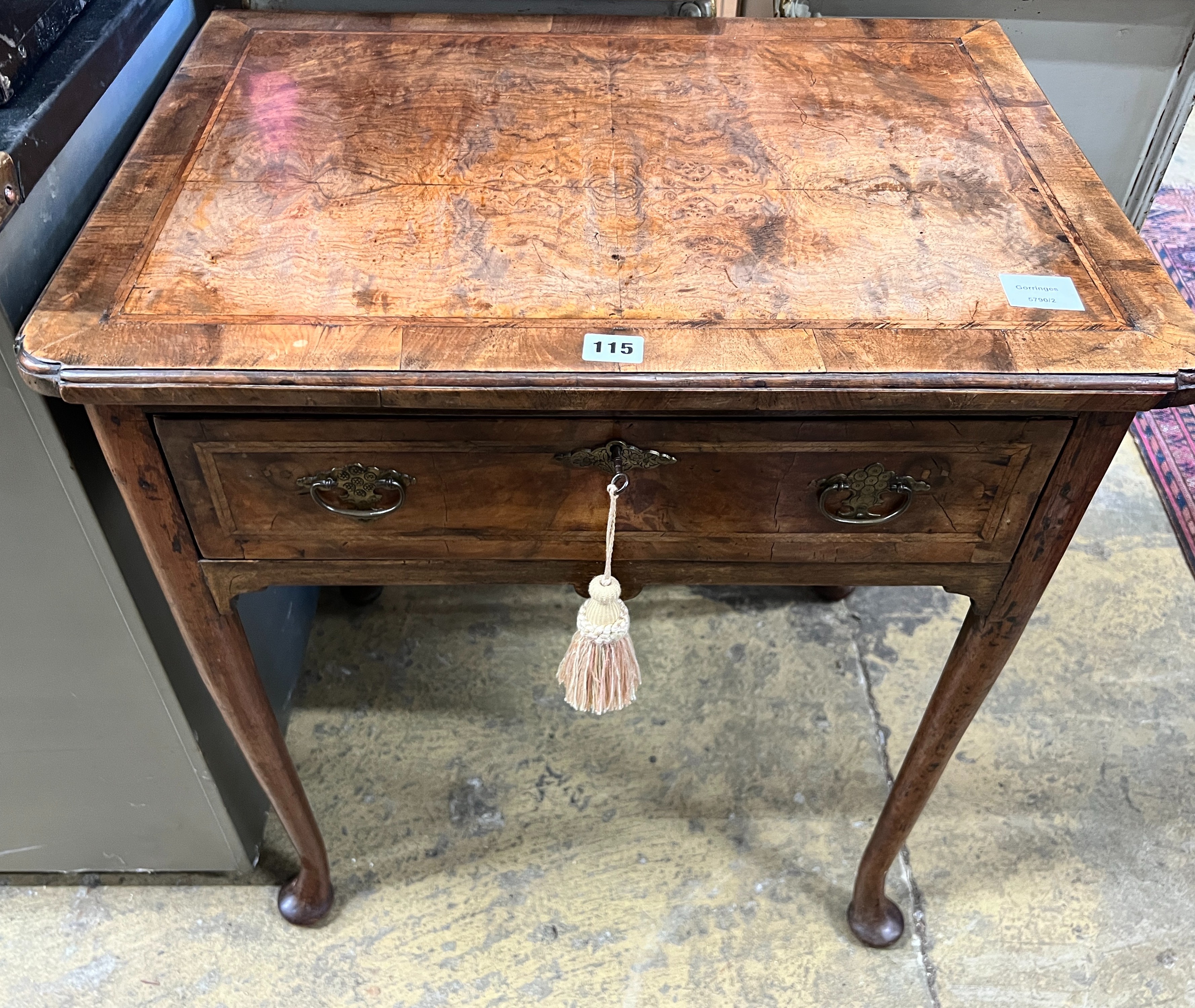 A small 18th century feather banded figured walnut veneered lowboy, width 64cm, depth 46cm, height 71cm